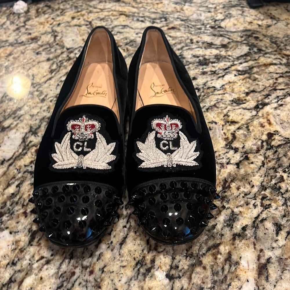 Red bottoms black velvet with cl design and red crown nice looking shoe